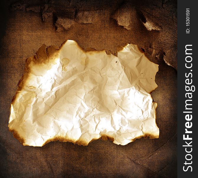 Vintage background with old burnt crumpled paper. Vintage background with old burnt crumpled paper