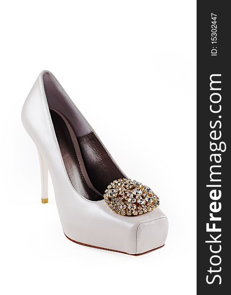 Leather white shoe, isolated on white, decorated with crystals.
Clipping path included. Leather white shoe, isolated on white, decorated with crystals.
Clipping path included.