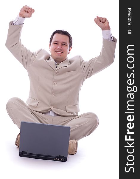 Excited caucasian 30s businessman alone over white background with computer. Excited caucasian 30s businessman alone over white background with computer