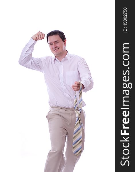 Excited caucasian 30s businessman with tie in his hand standing alone over white background. Excited caucasian 30s businessman with tie in his hand standing alone over white background.