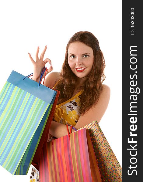 Pretty shopping girl with shoppingbags isolated on white background. Pretty shopping girl with shoppingbags isolated on white background