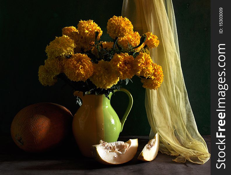 Still life with marigolds and melon