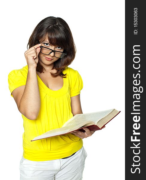 The student holds the book and corrects glasses