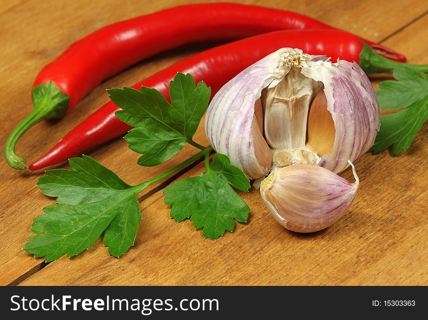 Fresh parsley leaf, garlic head and chili pepper. Fresh parsley leaf, garlic head and chili pepper