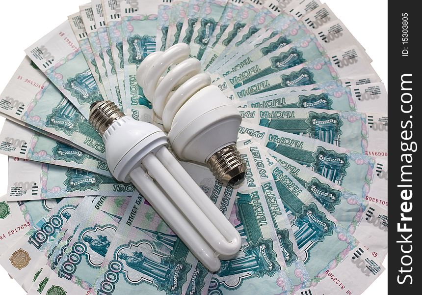 Energy saving bulb on the banknote background