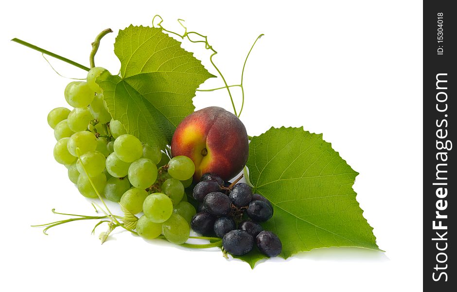 Grapes and peach isolated on white