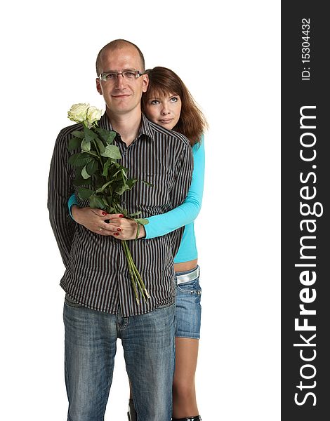 Happy young couple with a bouquet of white roses. Happy young couple with a bouquet of white roses