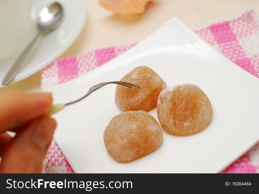 Fork taking sweets on plate. For concepts such as food and beverage, diet and nutrition, and healthy lifestyle.