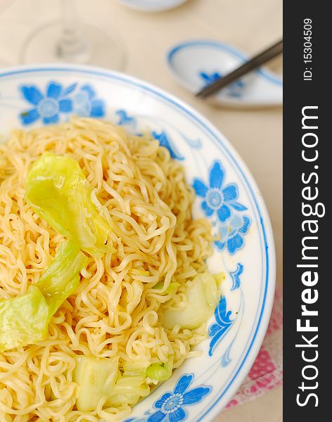 Chinese vegetarian yellow noodles. Suitable for concepts such as diet and slimming, healthy lifestyle, and food and beverage. Chinese vegetarian yellow noodles. Suitable for concepts such as diet and slimming, healthy lifestyle, and food and beverage.