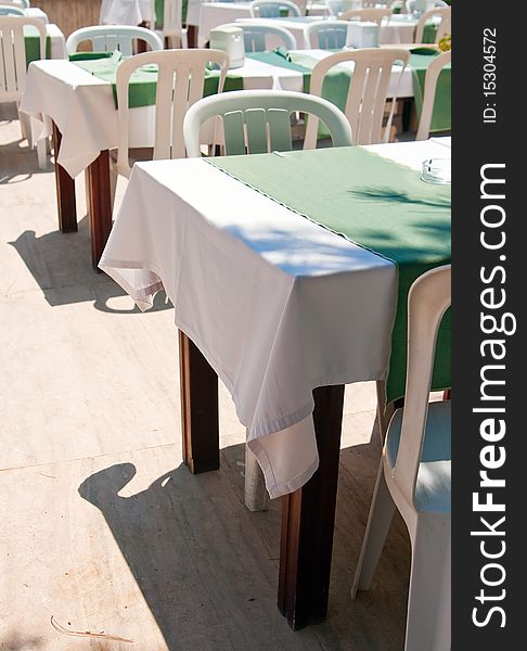 Table at outdoor restaurant awaiting diners