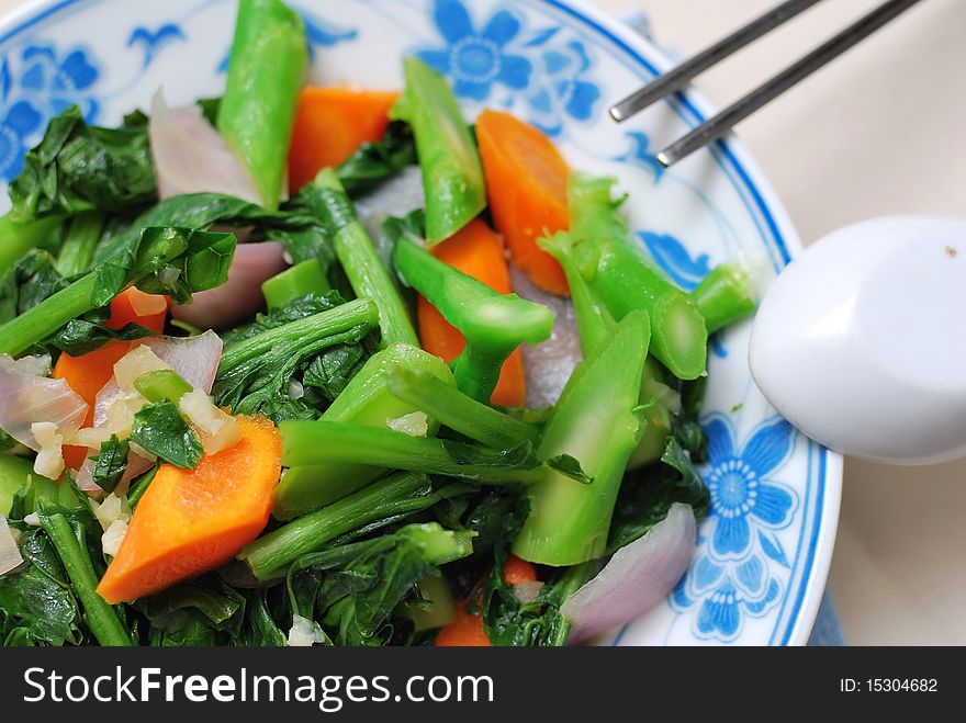 Simple green leafy vegetables from the cooked Chinese style. For concepts such as food and beverage, diet and nutrition, and healthy eating. Simple green leafy vegetables from the cooked Chinese style. For concepts such as food and beverage, diet and nutrition, and healthy eating.