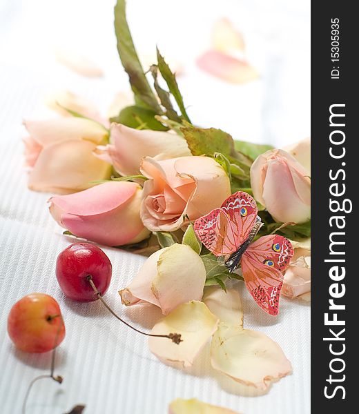 Beautiful pink roses with butterfly and cherry