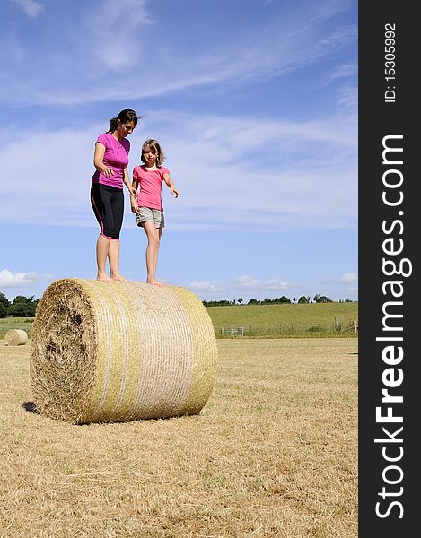 White People Playing Nature On Hay Bales