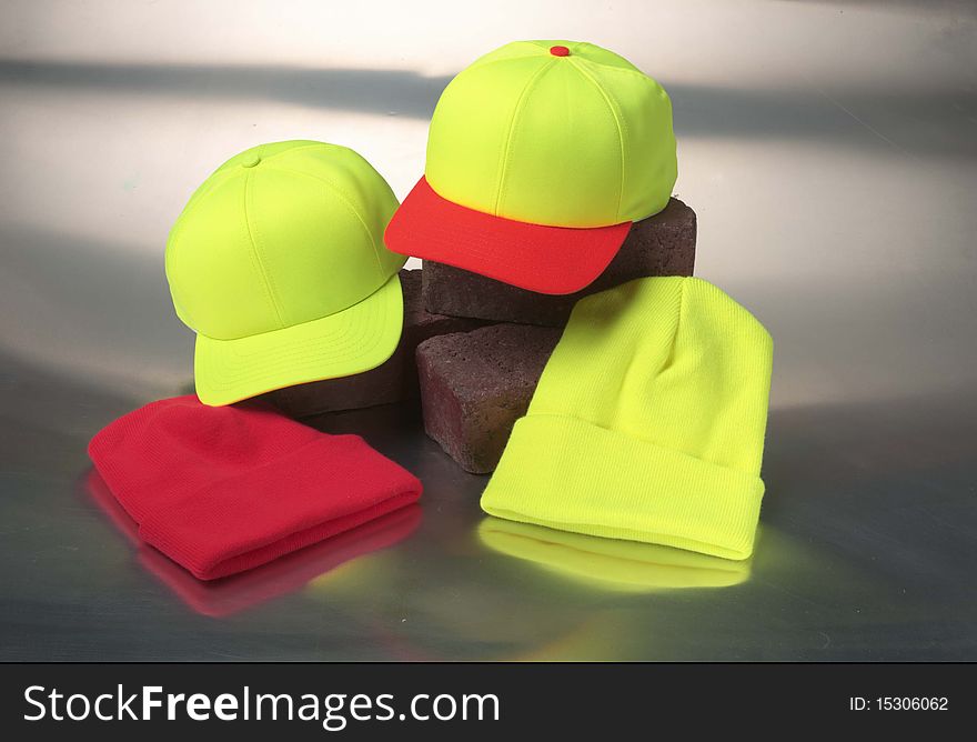 Four hats caps on a metal background. Four hats caps on a metal background