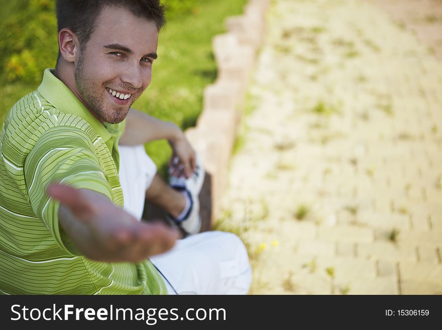 Cheerful Guy In A Green Vest.