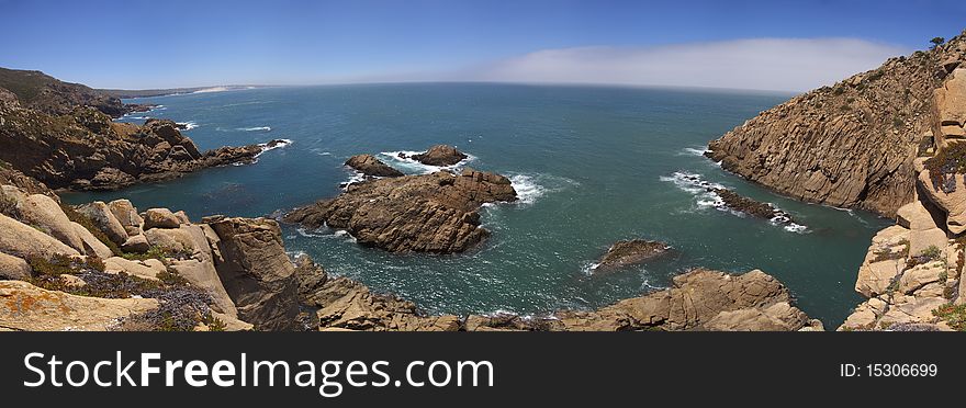 Ocean enters a small bay of rocks. Seascape panorama close to Cabo da Roca. Sintra, Portugal. Ocean enters a small bay of rocks. Seascape panorama close to Cabo da Roca. Sintra, Portugal