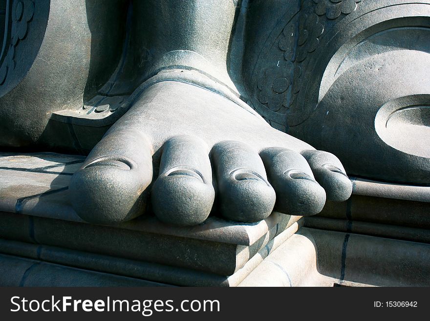 A close-up of Thiruvalluvar's feet on small island near Kanyakumar, Tamil Nadu, India. A close-up of Thiruvalluvar's feet on small island near Kanyakumar, Tamil Nadu, India