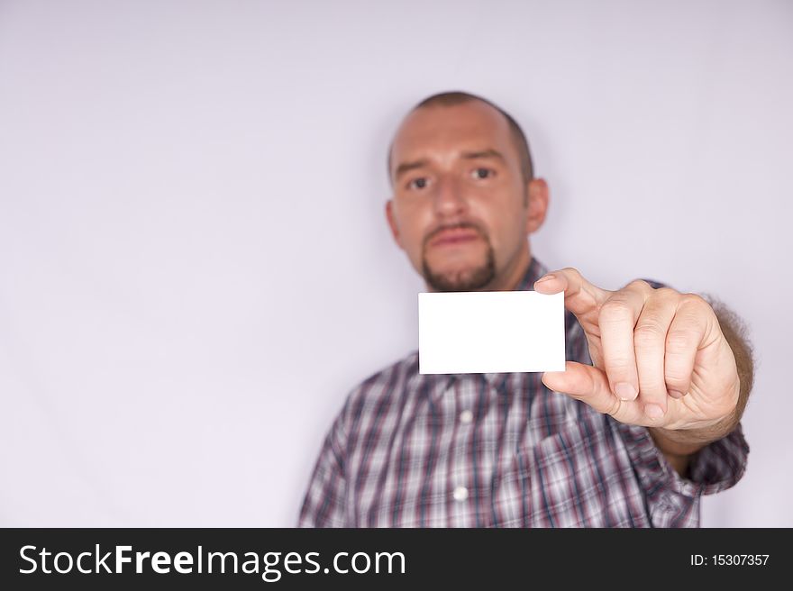Portrait of a nice man with shirt and blank business card. Portrait of a nice man with shirt and blank business card