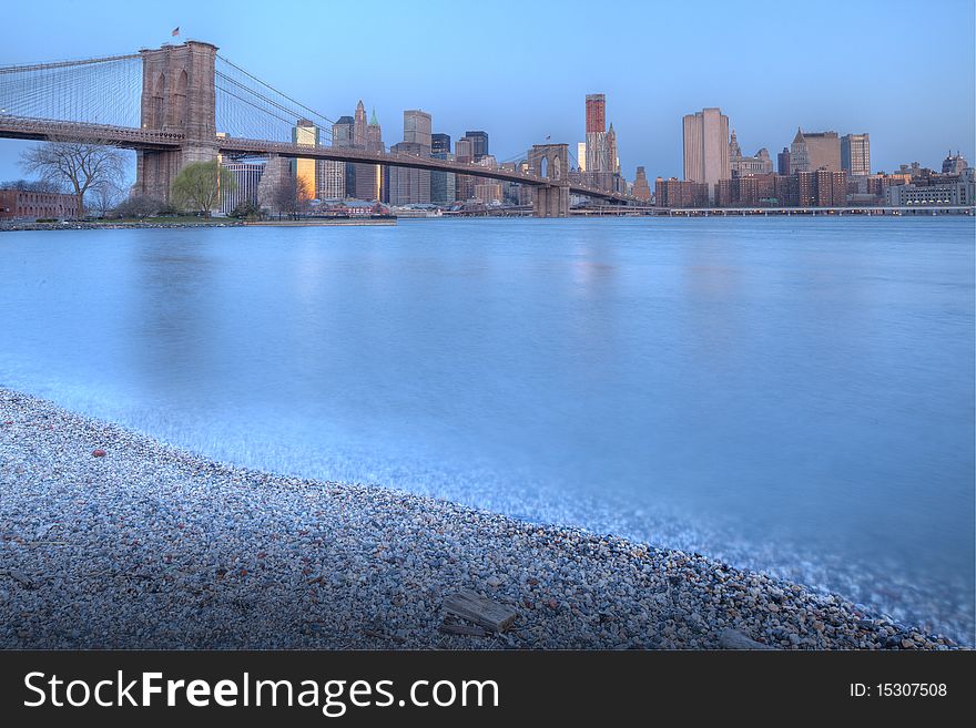 Brooklyn Bridge in the early morning from Brooklyn at beach