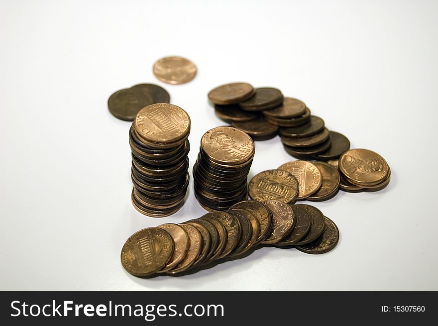 Stacks and piles of pennies to save. Stacks and piles of pennies to save