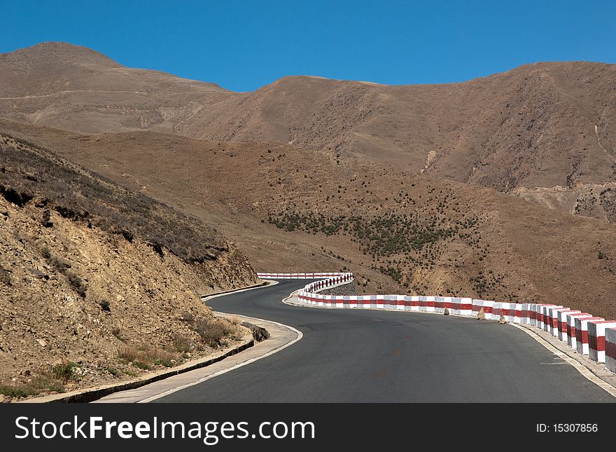 Yellowish mountain road view in tibet of China