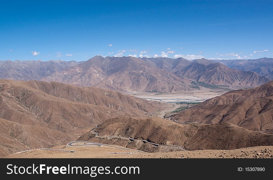 Yellowish mountain road view in tibet of China