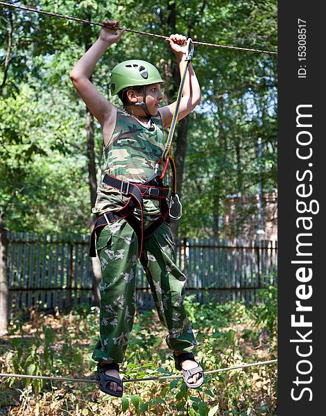 Portrait Of  Boy Wearing Helmet And Climbing.