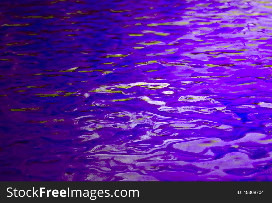 a background of blue textured stained glass with light and dark reflections. a background of blue textured stained glass with light and dark reflections