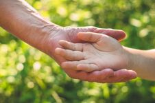 Childs Hand And Old Hand Grandmother. Concept Idea Of Love Family Protecting Children And Elderly People Grandmother Stock Photography