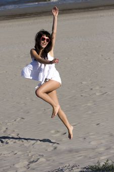 Happy Young Woman Is Dancing On The Beach Royalty Free Stock Images Happy Young Woman Is Dancing On The Beach Royalty Free Stock Images