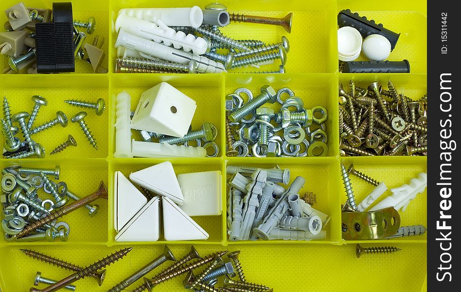 Part of blue toolbox with screws and dowels. Part of blue toolbox with screws and dowels