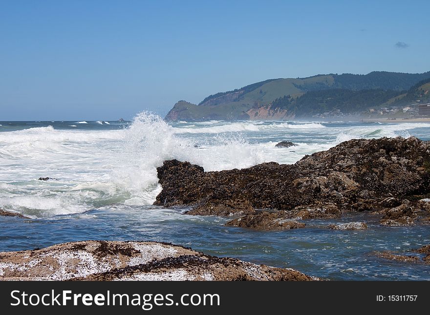 Rocks at low tide in the ocean water, Oregon Coast ocean view water splash. Rocks at low tide in the ocean water, Oregon Coast ocean view water splash