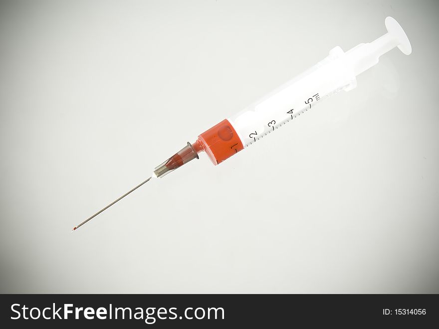 Photo of Medical Syringe vignetted background