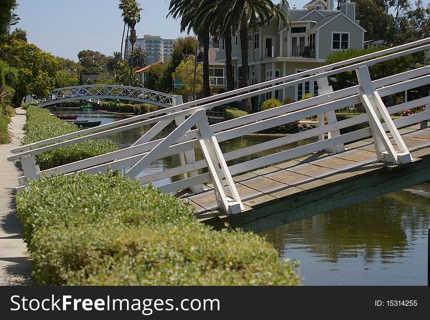 Two bridges over a canal in Venice, California. Two bridges over a canal in Venice, California.
