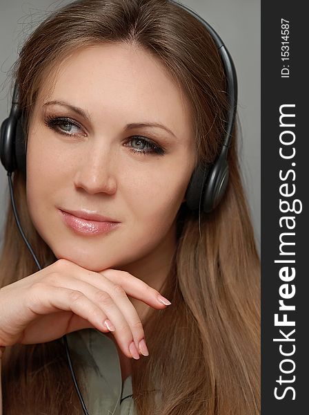 Young beautiful woman with headset. Young beautiful woman with headset