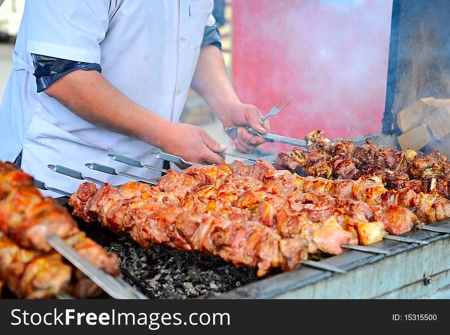 The image of shashlik cooking on barbecue