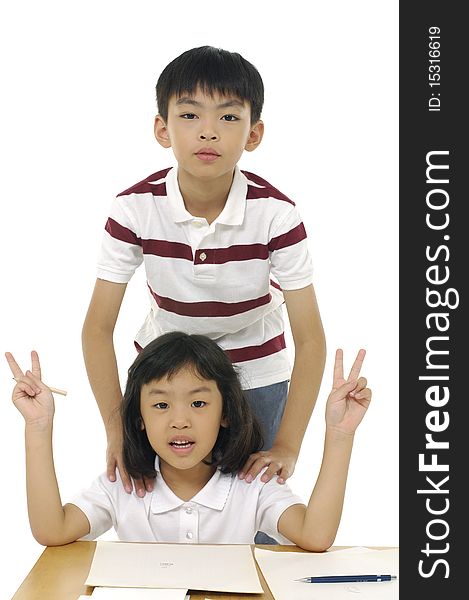 Cute children are playing and posing in studio