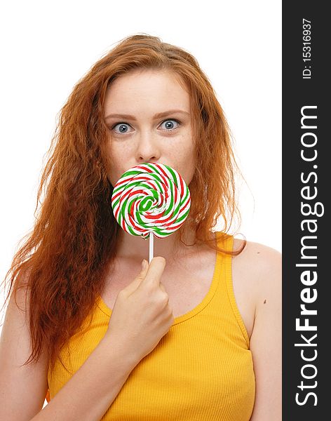 Young woman with lollypop on white
