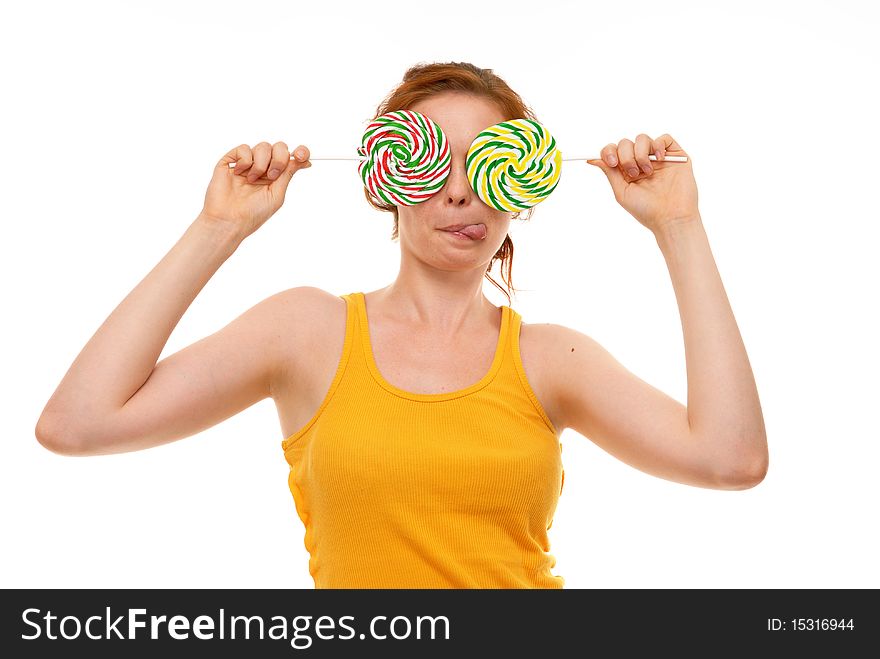 Young woman with lollypop on white