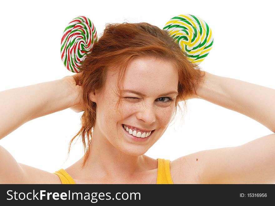 Young woman with lollypop on white