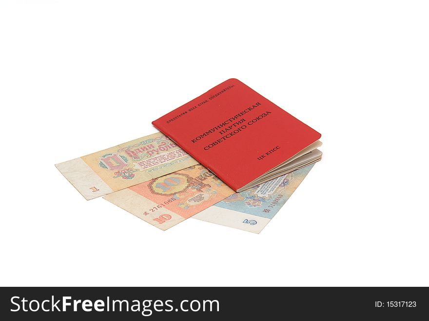 Soviet communist party membership card with Soviet money inside it isolated. Soviet communist party membership card with Soviet money inside it isolated