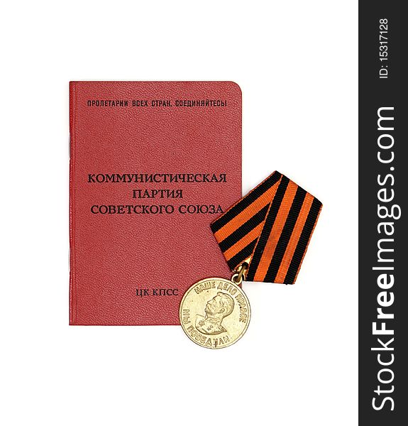 Soviet communist party membership card with old medal isolated. Soviet communist party membership card with old medal isolated