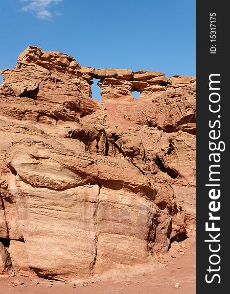 Scenic weathered orange rock in stone desert