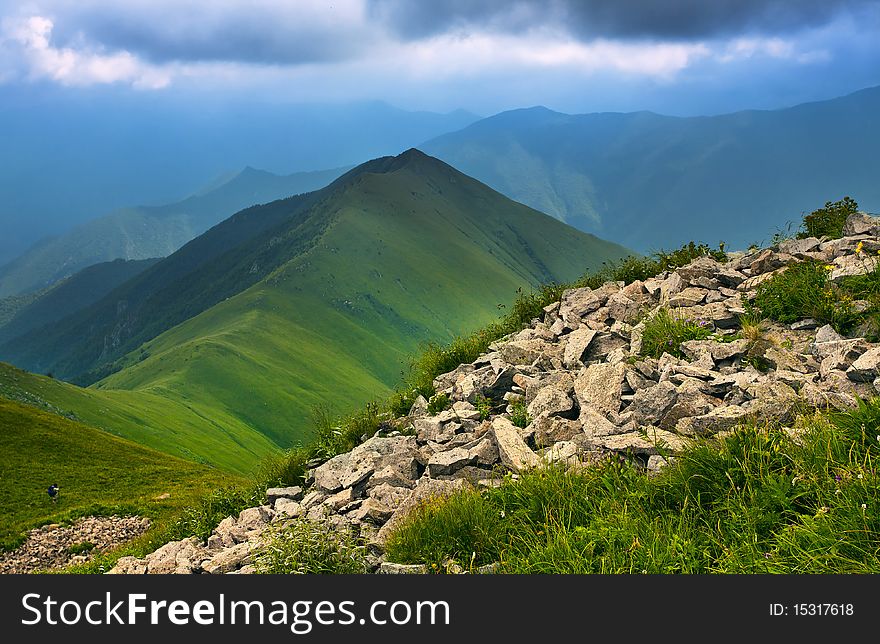 Mountain landscape with clouds and fog.