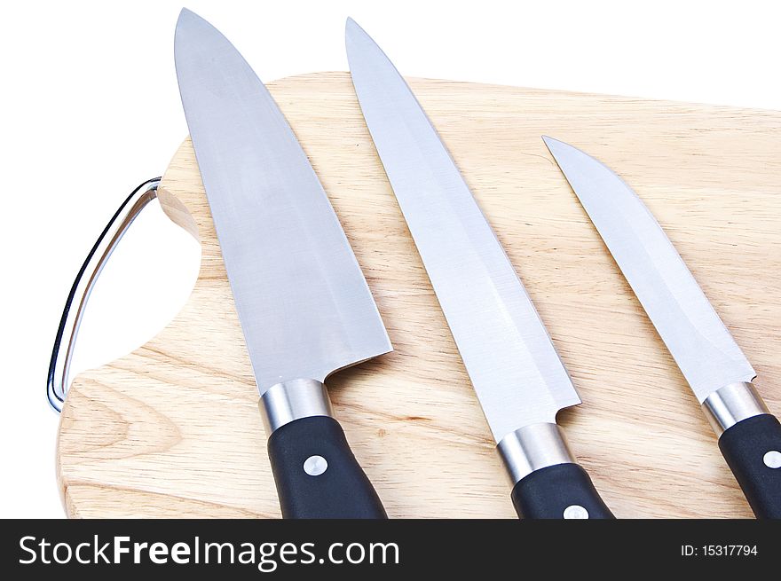 Cutting board with a knife isolated on a white background