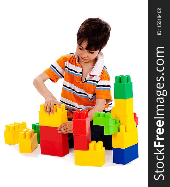 Cute little boy playing on white isolated background