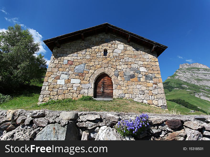 Chapel and lake in french mountain