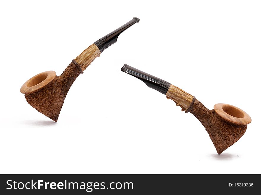 Some tobacco pipes isolated on white background