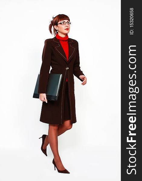 Woman walking with lap top computer business concept