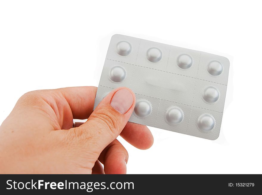 Human hand and packing the tablets on white background